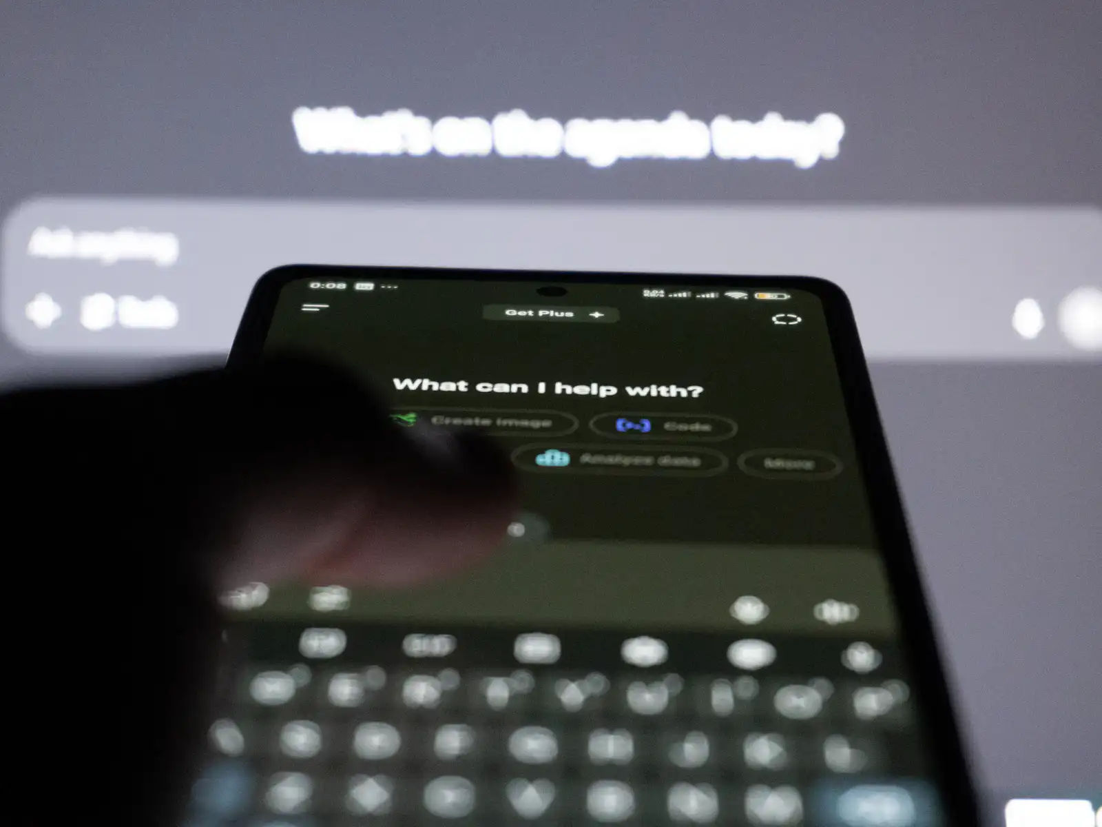 Person typing a question into an AI assistant on a smartphone