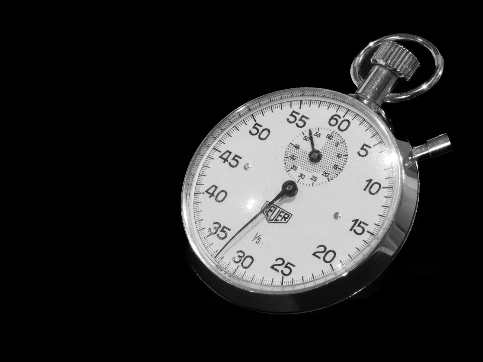 Close-up of a stopwatch on a black background